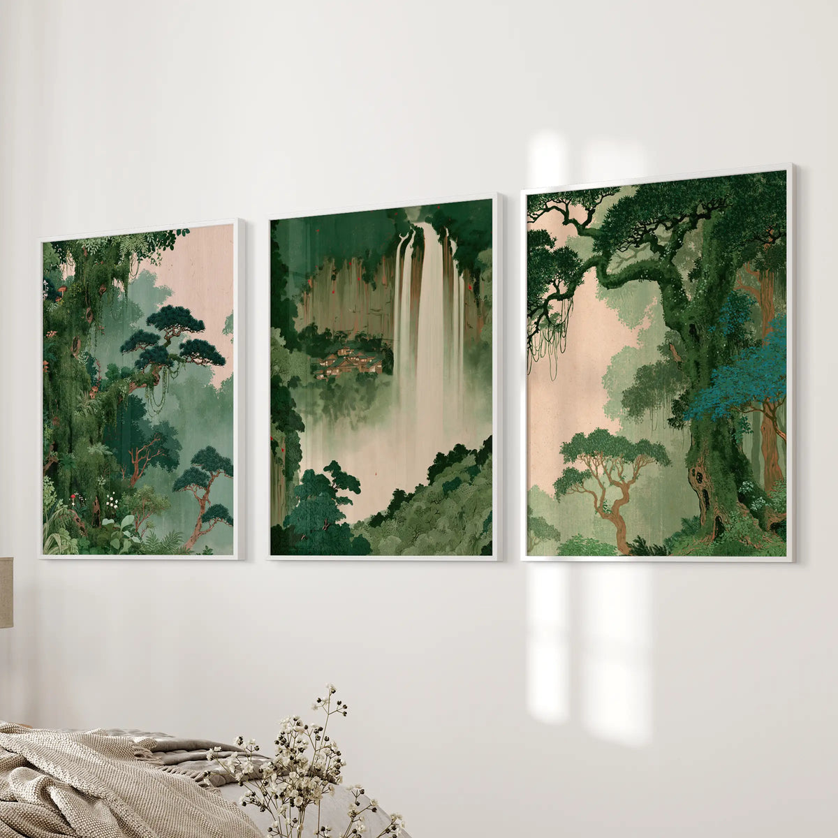 Woodland botanical wall art set of three white-framed prints, arranged near the bed in a bedroom.