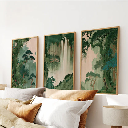 Woodland botanical wall art set of three prints in wooden frames, arranged above the headboard in a bedroom.