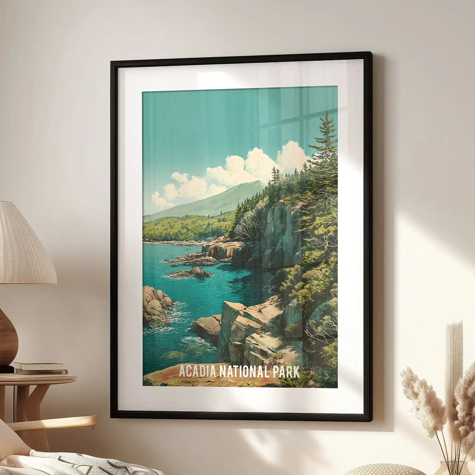 Maine Atlantic coast shoreline single wall art print in a black frame with mat, placed above an accent chair to ground a relaxed living room nook.