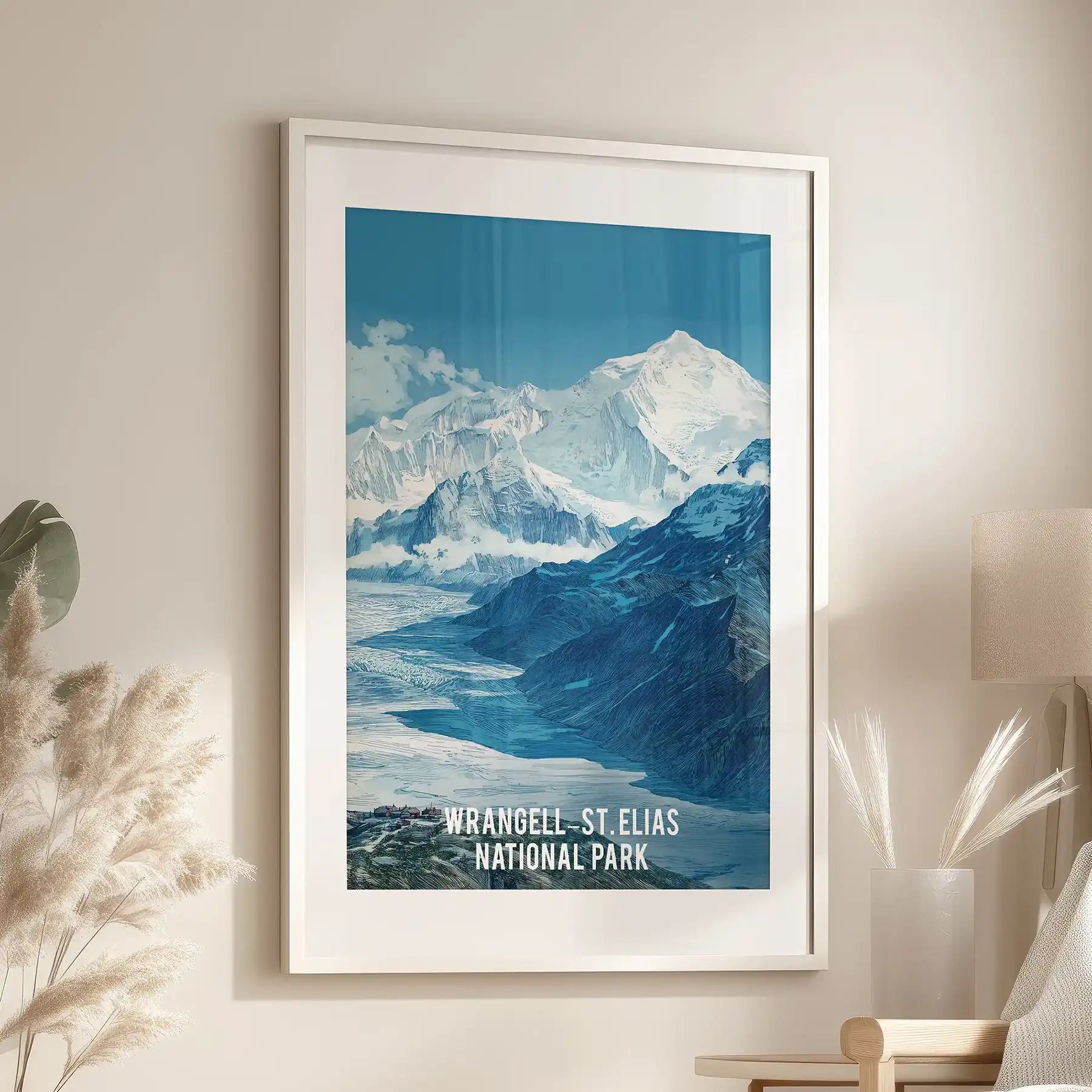Frozen wilderness valley single wall art print comes white-framed with a mat, positioned over an accent chair in the living room, evoking Alaska’s chill.