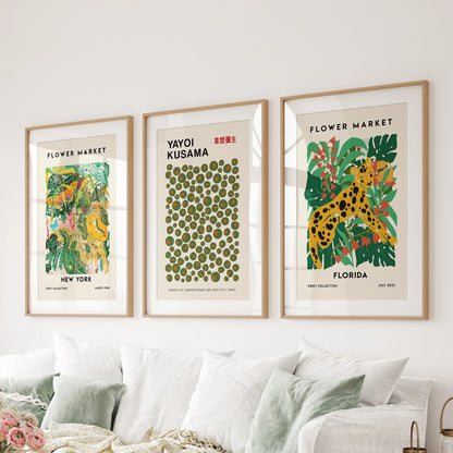 Kusama-inspired dotted wall art in three thin wood-matted frames brings crisp, joyful rhythm to the lounge behind the couch.