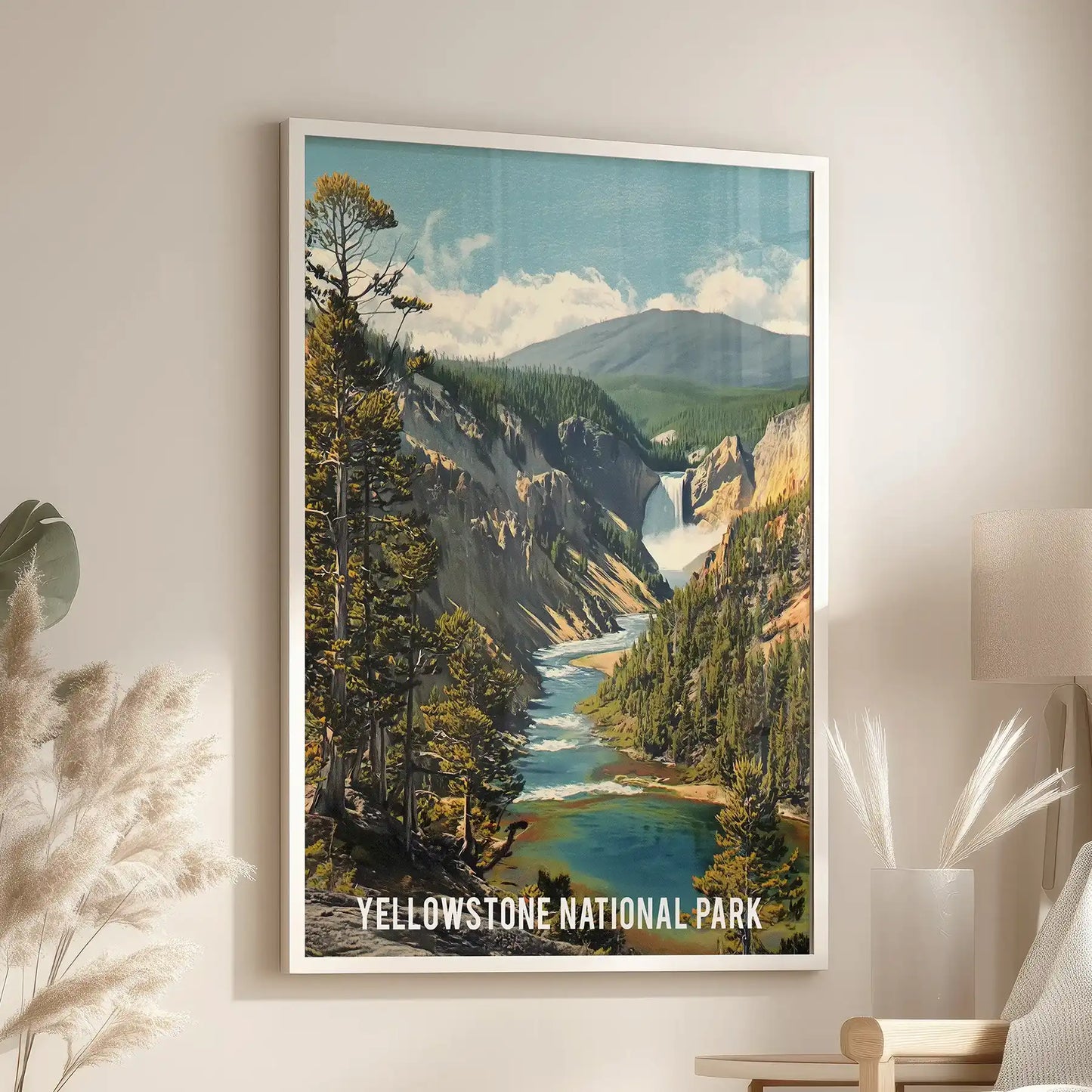 Yellowstone landscape artwork for wall cozies up the lounge, a white framed print positioned just above the armchair.