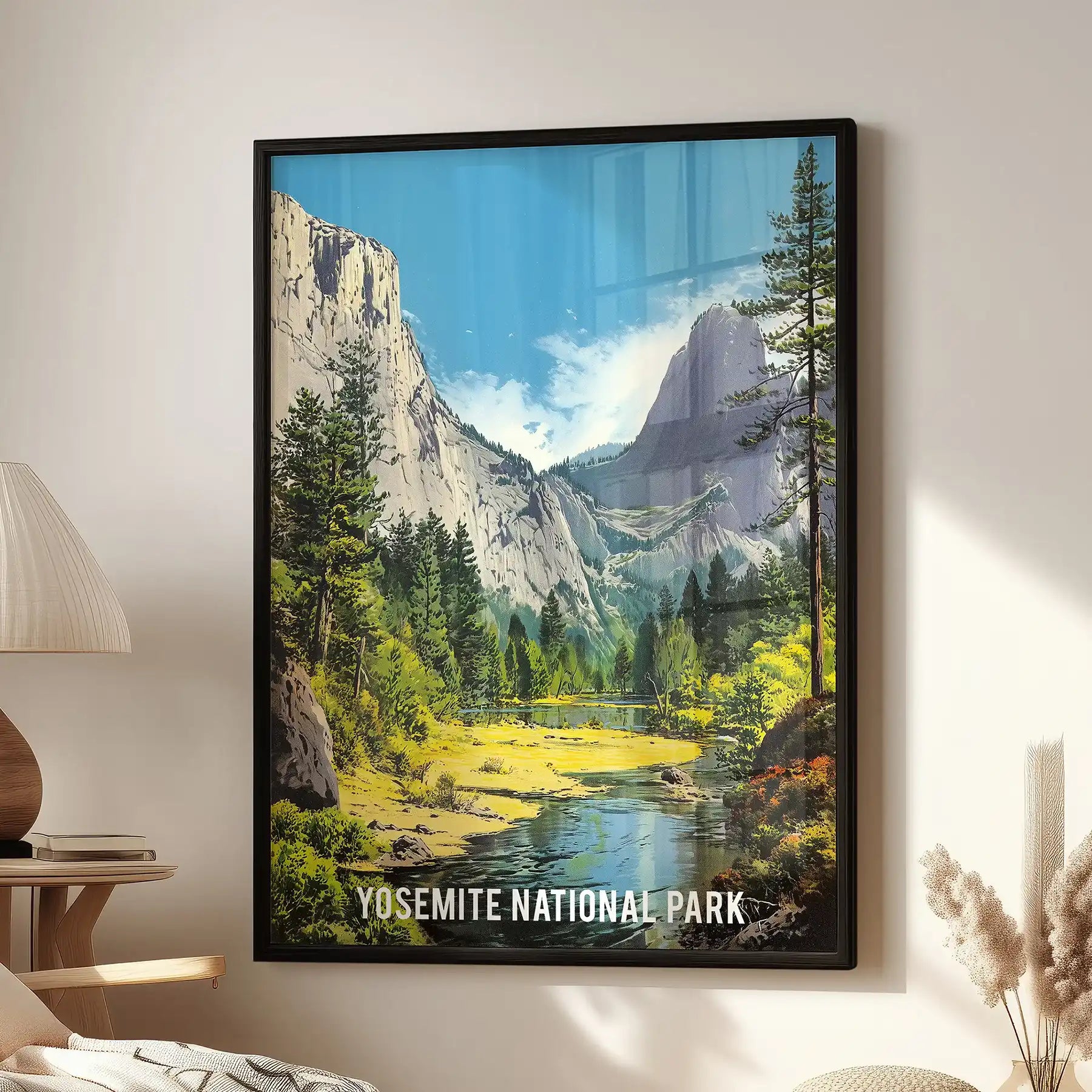 Yosemite National Park landscape, a large black-framed wall art print, hangs over the living room chair to ground the space.