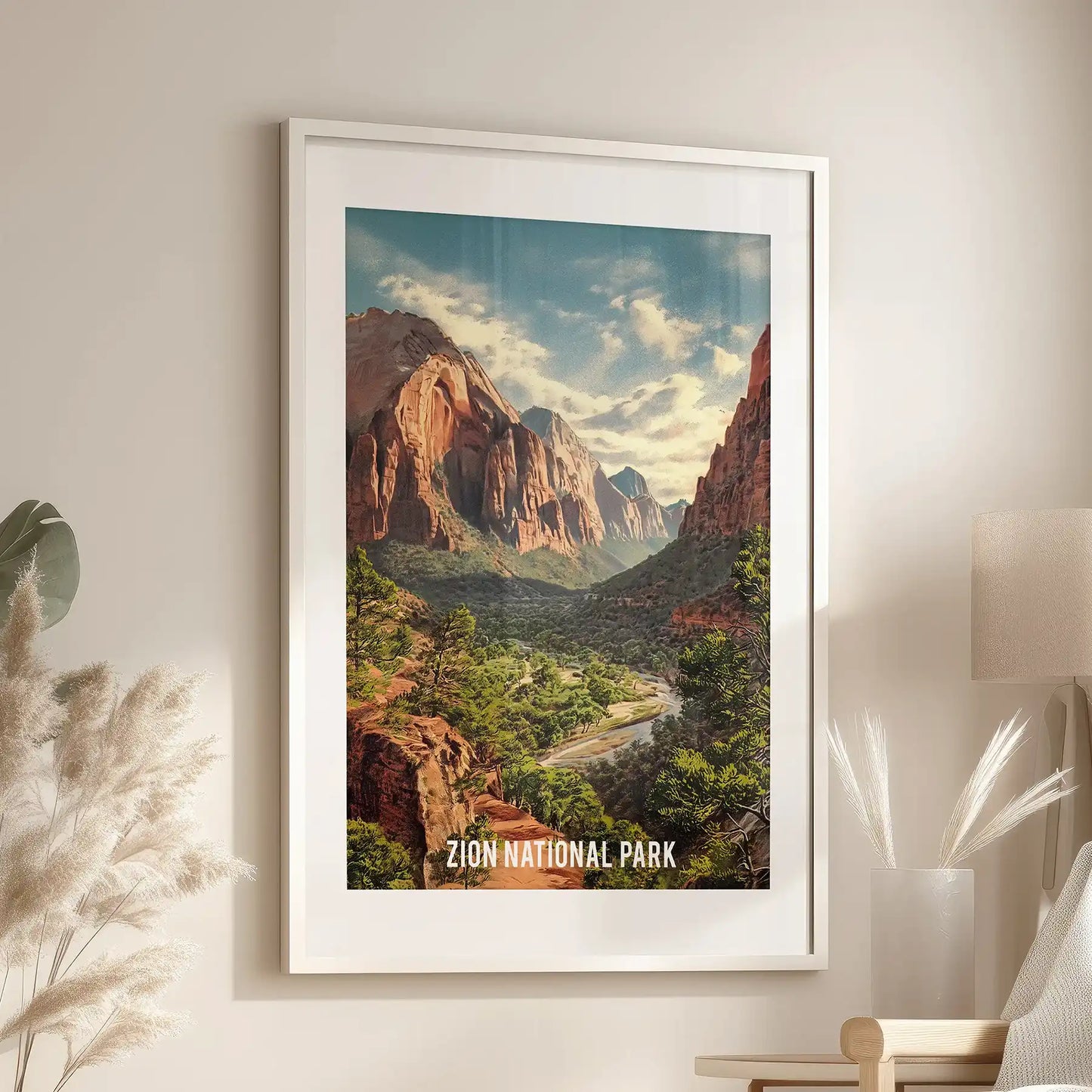 Canyon valley landscape wall art, set in a white mat frame, sits over the reading chair in the sitting room, capturing ochre cliffs, river bends, and big sky.