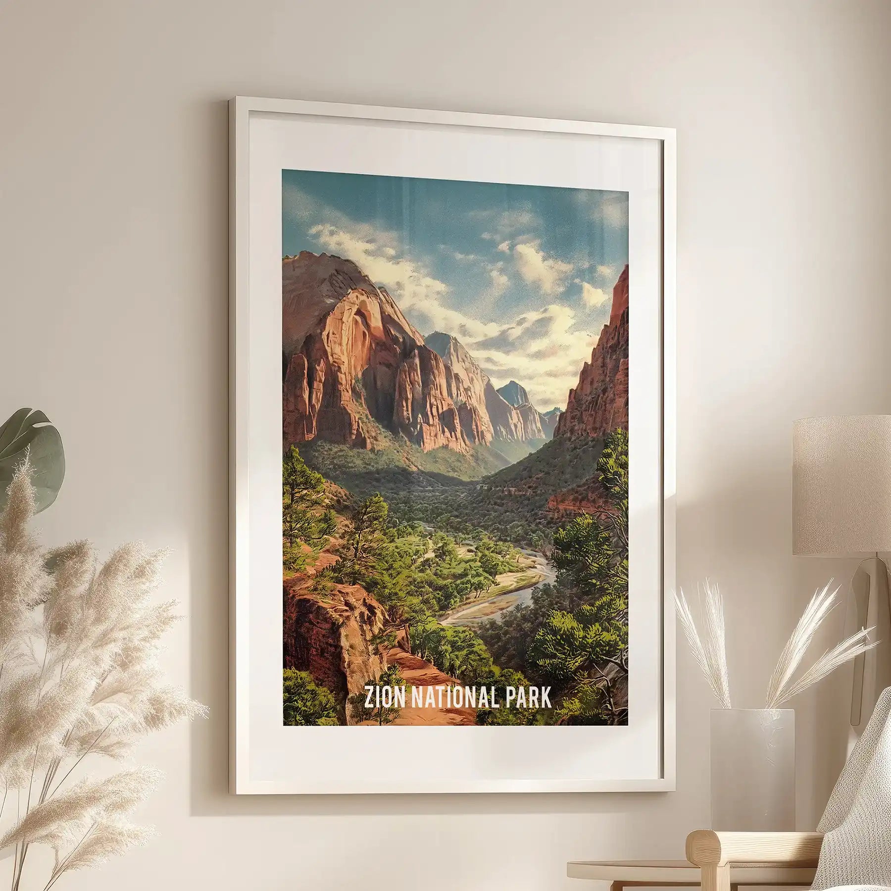 Canyon valley landscape wall art, set in a white mat frame, sits over the reading chair in the sitting room, capturing ochre cliffs, river bends, and big sky.