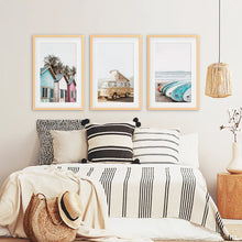 Load image into Gallery viewer, Coastal Set of 3 Prints in Beige, Blue and Pink Tones. Ocean Beach with Surfboards, Cabins, Yellow Travel Van. Wood Frames with Mat
