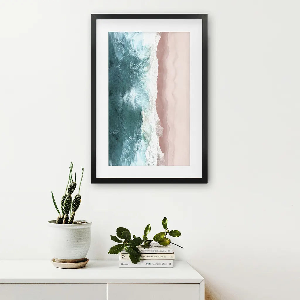 Ocean Aerial Print. Neutral Pink Beach, Blue Waves. Black Frame with Mat