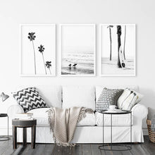 Load image into Gallery viewer, 3 Piece Black White Ocean Surf Print Set. Surfers, Palm Trees, Surfboard on the Beach. White Frames

