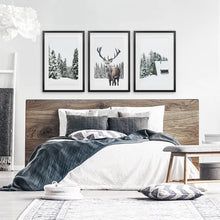 Load image into Gallery viewer, 3 Piece Christmas Wall Art. Forest, Log Cabin, Reindeer. Black Frames with Mat
