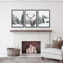 Load image into Gallery viewer, 3 Piece Christmas Wall Art. Forest, Log Cabin, Reindeer. Black Frames
