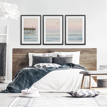 Load image into Gallery viewer, Ocean Sunset Photography with a Pier and Seagulls. Set of 3 Prints. Black Frames with Mat
