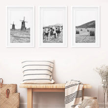 Load image into Gallery viewer, Windmill, 3 Cows, Hay Bales. Wall Art Set- White Frames with Mat
