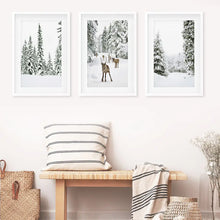 Load image into Gallery viewer, 3 Piece Winter Landscape Wall Art. Snowy Forest, Fawn. White Frames with Mat
