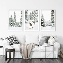 Load image into Gallery viewer, 3 Piece Winter Landscape Wall Art. Snowy Forest, Fawn. White Frames
